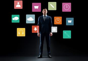 Image showing businessman in suit over virtual menu icons