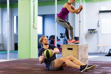 Image showing woman and man with medicine ball exercising in gym