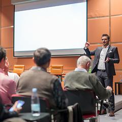 Image showing Business speaker giving a talk at business conference event.