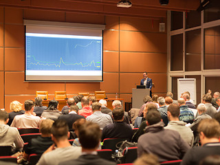 Image showing Business speaker giving a talk at business conference event.