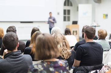 Image showing Man giving presentation in lecture hall at university.