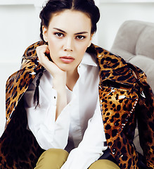 Image showing pretty stylish woman in fashion dress with leopard print together in luxury rich room interior, lifestyle people concept, modern brunette together 