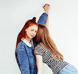 Image showing best friends teenage girls together having fun, posing emotional on white background, besties happy smiling, lifestyle people concept close up. making selfie