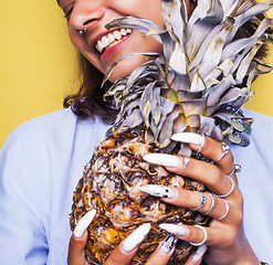 Image showing lifestyle people concept. young pretty smiling indian girl with pineapple, asian summer fruits