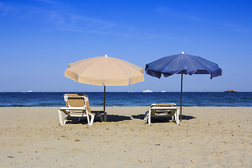 Image showing Chairs and umbrellas on a beautiful sandy beach at Ibiza