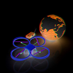 Image showing Quadrocopter Drone with Earth Globe and remote controller on a w