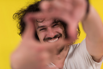 Image showing young man with funny hair over color background