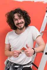 Image showing man with funny hair over color background with brush