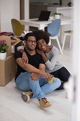 Image showing African American couple relaxing in new house