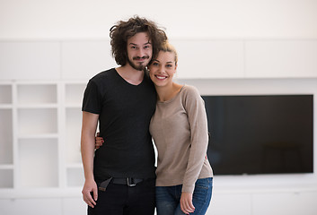 Image showing couple hugging in their new home