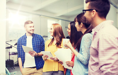 Image showing creative team on coffee break talking at office