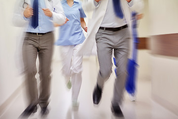 Image showing close up of medics or doctors running at hospital