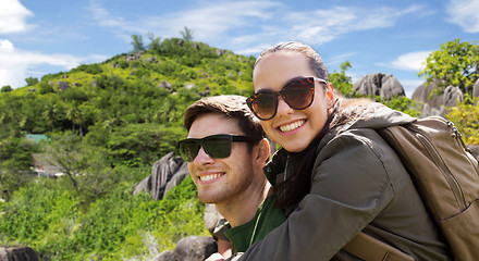 Image showing happy couple with backpacks traveling