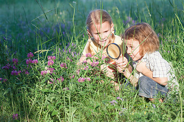 Image showing Two happy children  playing in the park at the day time.