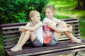 Image showing Two happy children  playing in the park at the day time.