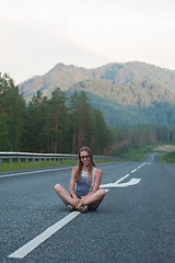 Image showing Woman sitting on the road