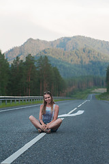 Image showing Woman sitting on the road