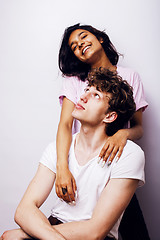 Image showing young couple of mixed races girlfriend and boyfriend having fun on white background, lifestyle teenage people concept 