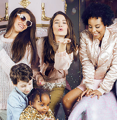 Image showing Lifestyle and people concept: young pretty diversity nations woman with different age children celebrating on birth day party together happy smiling, making selfie. African-american, asian and caucasi