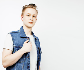 Image showing young handsome teenage hipster guy posing emotional, happy smiling against white background isolated, lifestyle people concept 