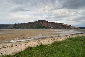 Image showing Sandy coast with mountain in Tanamunningen Nature Reserve in Norther Norway