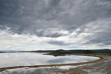 Image showing Dark cloudy sky with coast in Northern Norway