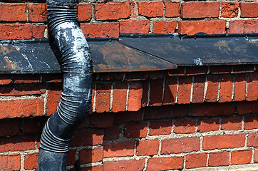 Image showing old drainpipe on a brick wall