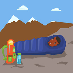 Image showing Man resting in sleeping bag in the mountains.