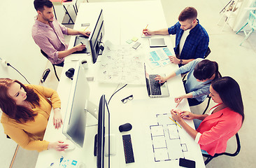 Image showing creative team with computers, blueprint at office