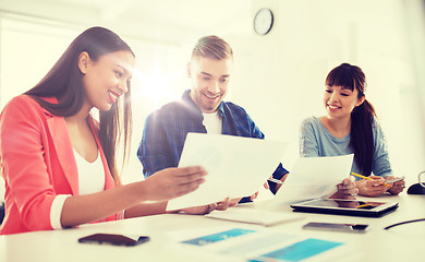 Image showing happy creative team or students working at office