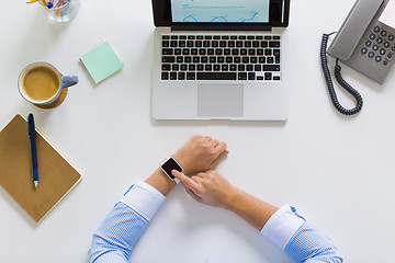 Image showing hands of businesswoman working on laptop at office