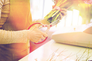 Image showing close up of florist making bunch at flower shop