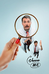 Image showing Closeup portrait of smiling, happy, surprised, young business man, on blue background.