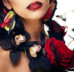 Image showing pretty brunette woman with rose jewelry, black and red, bright m