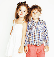 Image showing little cute boy and girl hugging playing on white background, happy smiling family, lifestyle people concept 