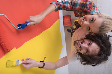 Image showing couple painting interior wall