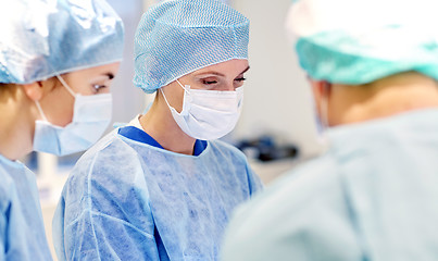 Image showing group of surgeons in operating room at hospital