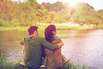 Image showing happy couple hugging on lake or river bank
