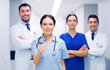 Image showing medics or doctors at hospital showing thumbs up