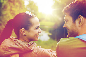 Image showing smiling couple with backpacks in nature