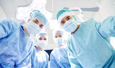 Image showing group of surgeons in operating room at hospital