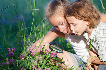 Image showing Two happy children  playing in the park at the day time.