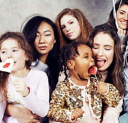 Image showing Lifestyle and people concept: young pretty diversity nations woman with different age children celebrating on birth day party together happy smiling, making selfie. African-american, asian and caucasi