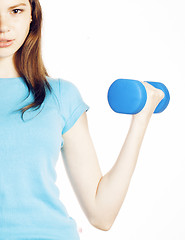 Image showing young pretty brunette woman with blue dumbbell isolated cheerful smiling, part of body, diet people concept on white background