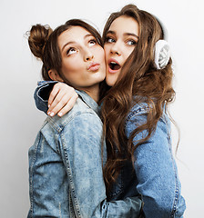 Image showing best friends teenage girls together having fun, posing emotional on white background, besties happy smiling, lifestyle people concept close up