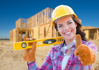 Image showing Female Construction Worker with Thumbs Up Holding Level Wearing 