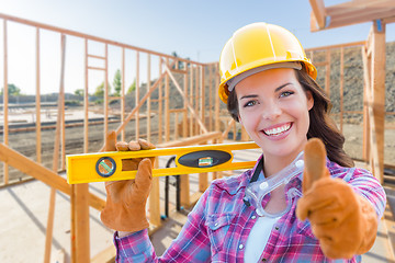 Image showing Female Construction Worker with Thumbs Up Holding Level Wearing 