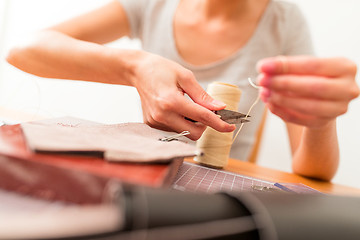 Image showing Leather handbag making in a workshop