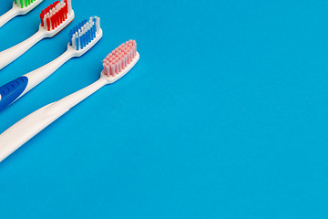 Image showing Image of several multi-colored toothbrushes