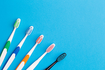 Image showing Five toothbrushes , space for text